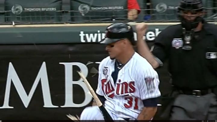 Twins' right fielder Oswaldo Arcia splinters his bat after striking out