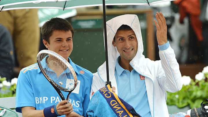 Watch: Novak Djokovic chats with a French Open ball boy during rain delay Watch: Novak Djokovic chats with a French Open ball boy during rain delay
