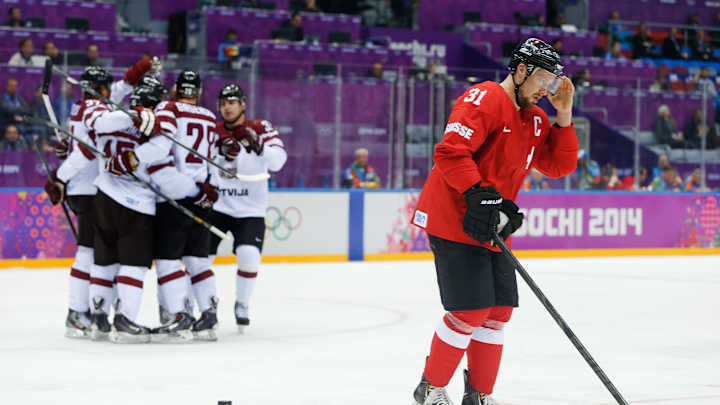 Latvia holds off Switzerland 3-1 to reach quarterfinals
