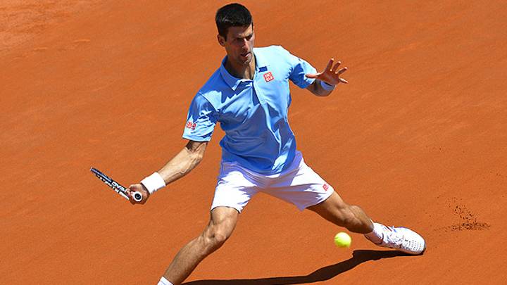 Novak Djokovic fends off Ernests Gulbis to advance to the French Open final Novak Djokovic fends off Ernests Gulbis to advance to the French Open final