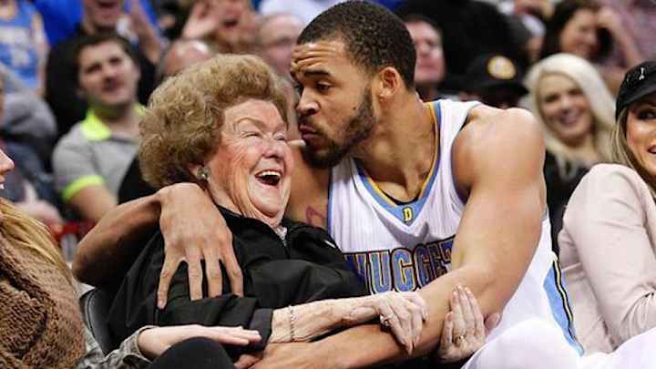 Nuggets center JaVale McGee kisses fan after landing in stands