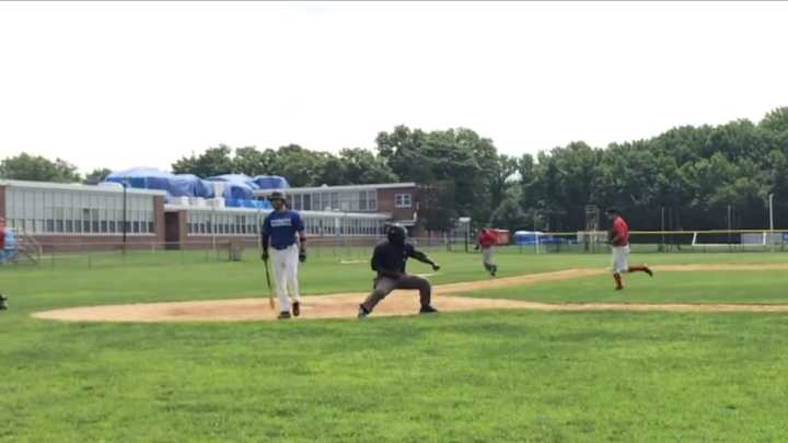 Over-the-top amateur ump gets every last ounce out of each strike call