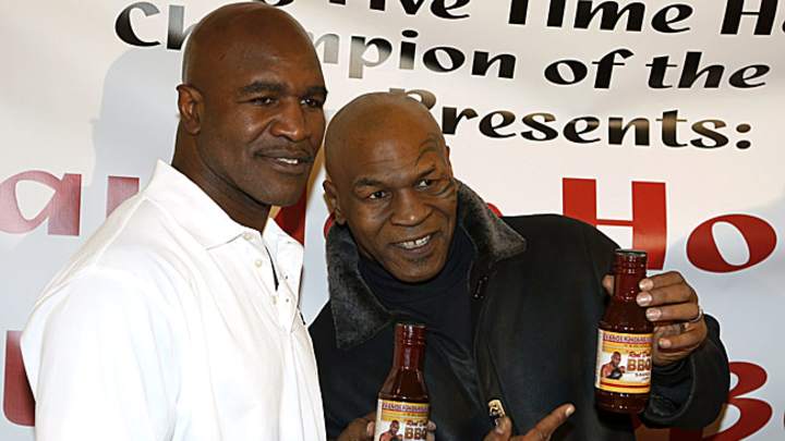 Tyson, Holyfield meet in Chicago at sauce event