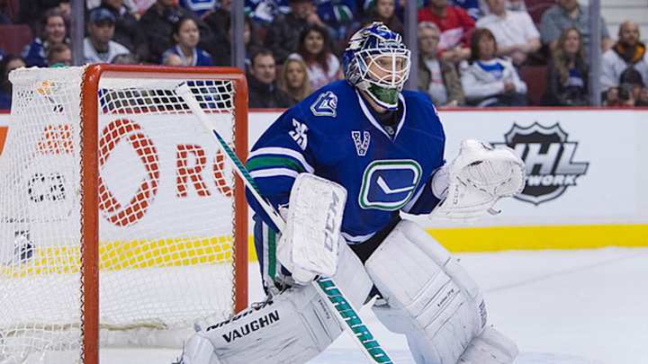Canucks' goalie Schneider practices with team Canucks' goalie Schneider practices with team