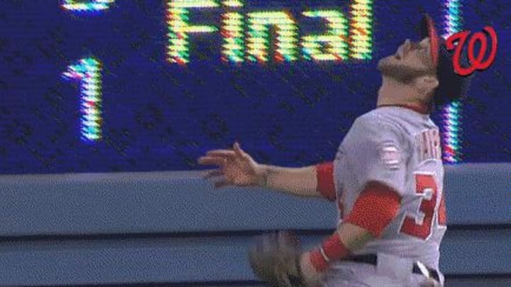 Bryce Harper leaves game with bloody neck after running into outfield scoreboard
