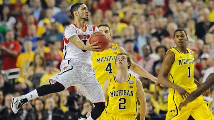 Louisville bests Michigan in epic NCAA title clash Louisville bests Michigan in epic NCAA title clash