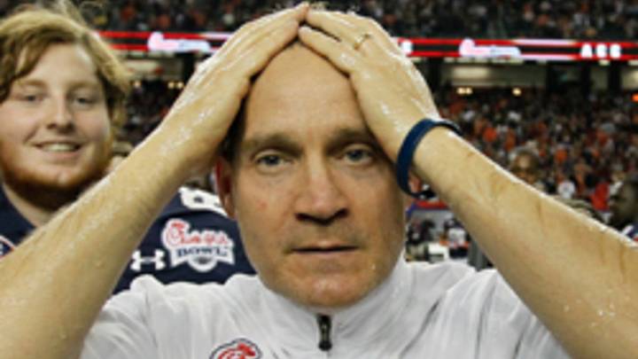 Report: Auburn paid players, altered grades under former coach Gene Chizik Report: Auburn paid players, altered grades under former coach Gene Chizik