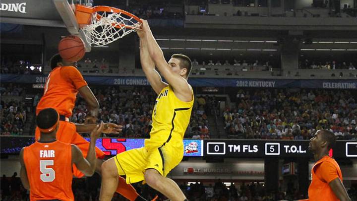 Opposites Attract In Louisville-Michigan National Title Game