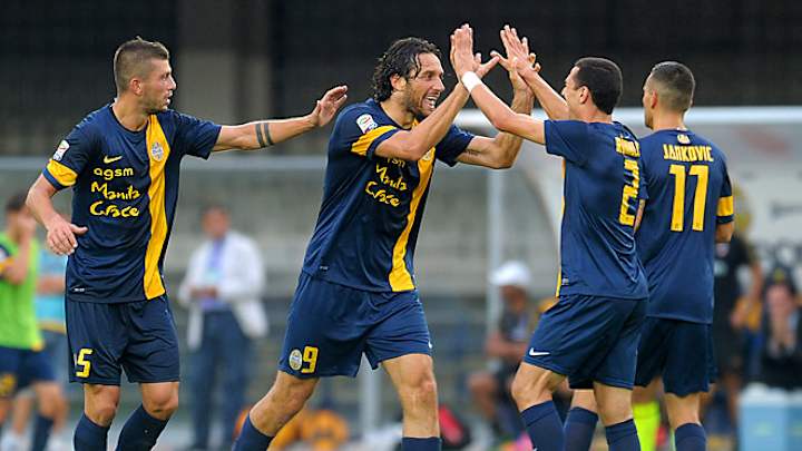 Promoted Verona shocks AC Milan, Juventus wins opener