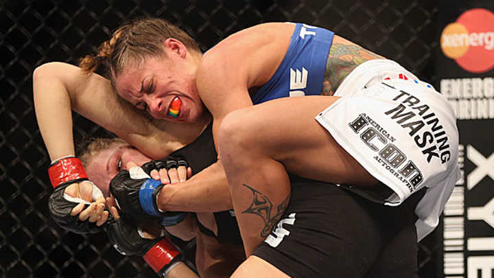 Rousey wins historic women's debut at UFC 157
