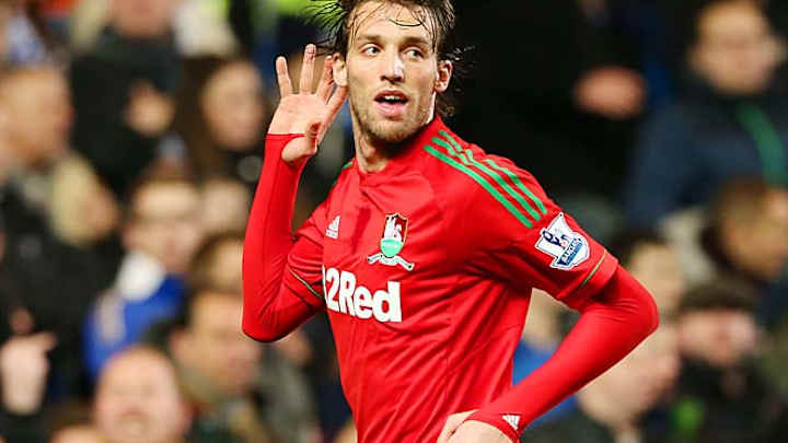 Michu signs four-year deal with Swansea