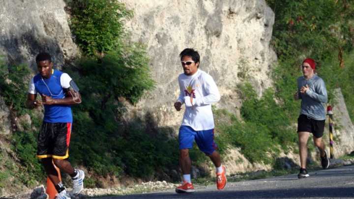 Manny Pacquiao dedicates fight to typhoon victims, but won't visit just yet