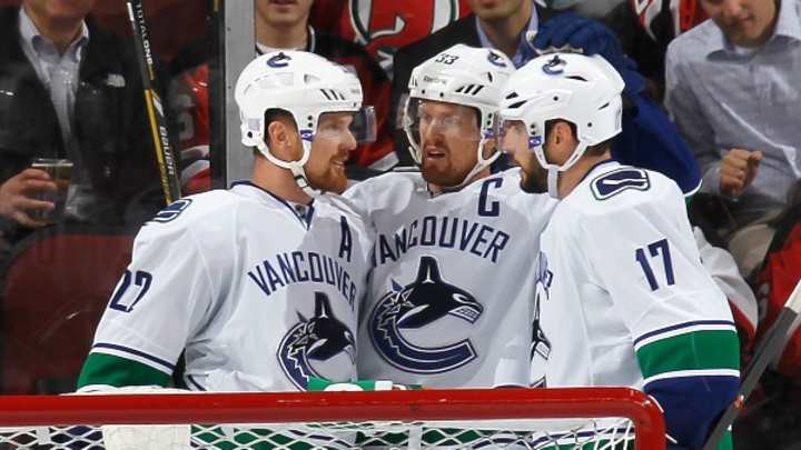 Canucks sign Sedin twins to matching four-year deals