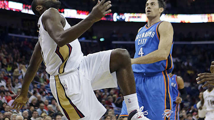 Tyreke Evans helped off court after rolling ankle