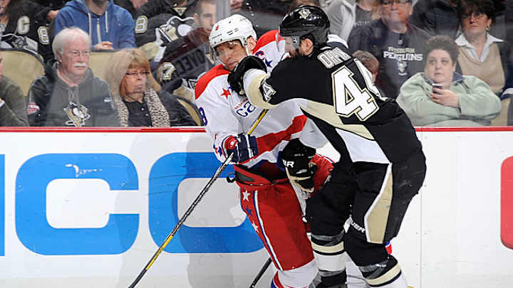 Streaking Penguins winning with defense