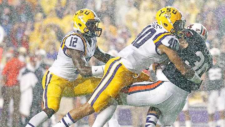 LSU's Les Miles: Heavy rain against Auburn was 'wind-driven dew'