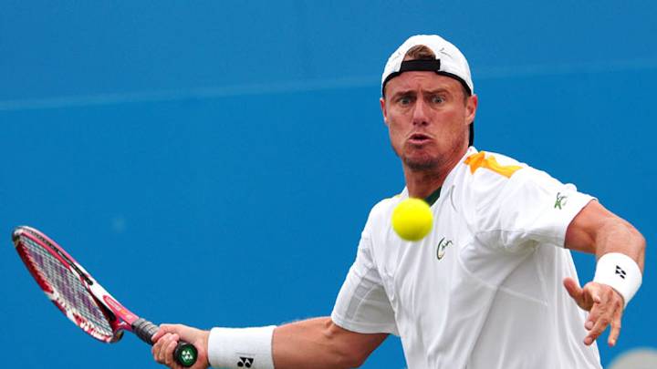 Lleyton Hewitt rallies past Michael Russell in Queen's first round