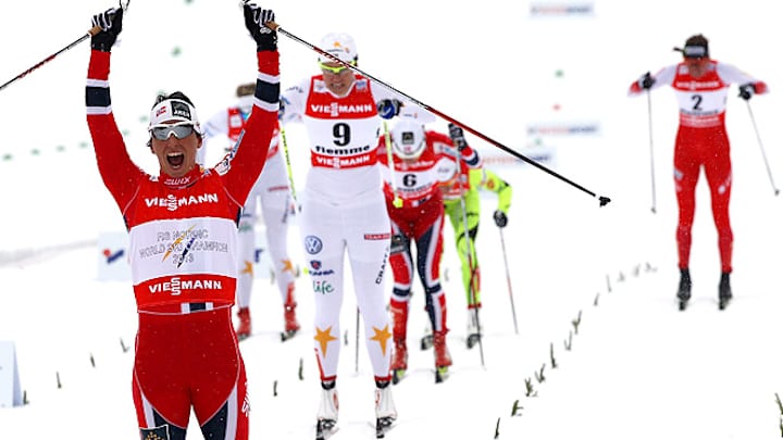 Bjoergen, Kriukov win gold in individual sprint at Nordic worlds