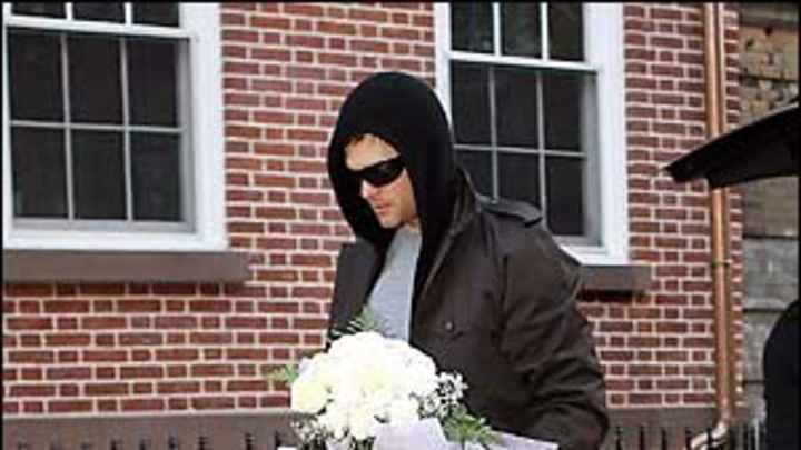 Brady photographed in walking cast