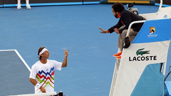 Controversy erupts as John Isner edges David Nalbandian in marathon match