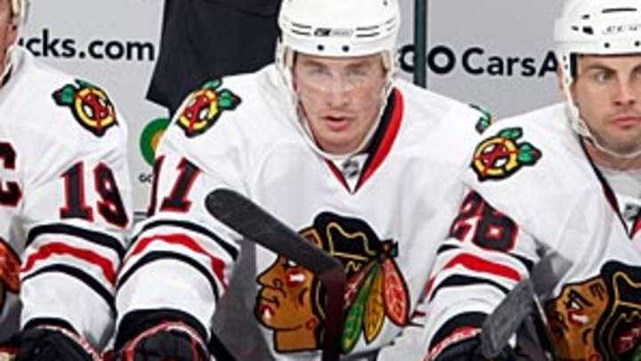 Blackhawks ax coach Denis Savard, Joel Quenneville assumes position