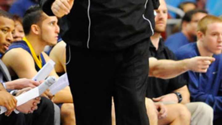 In sea of Armani-clad coaches, Huggins stands out with tracksuit