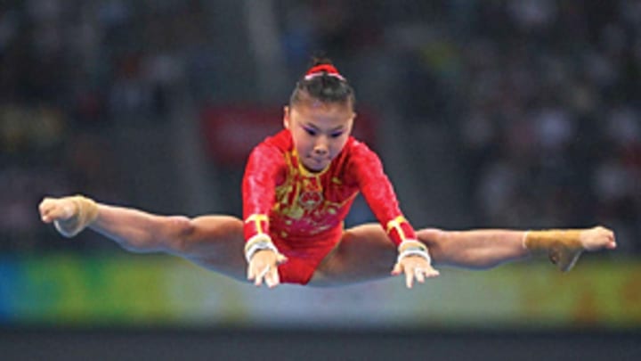 Chinese news service reported that gold medal gymnast was 13