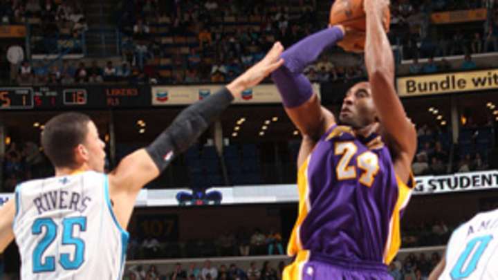 Kobe becomes youngest to reach 30,000 points Kobe becomes youngest to reach 30,000 points