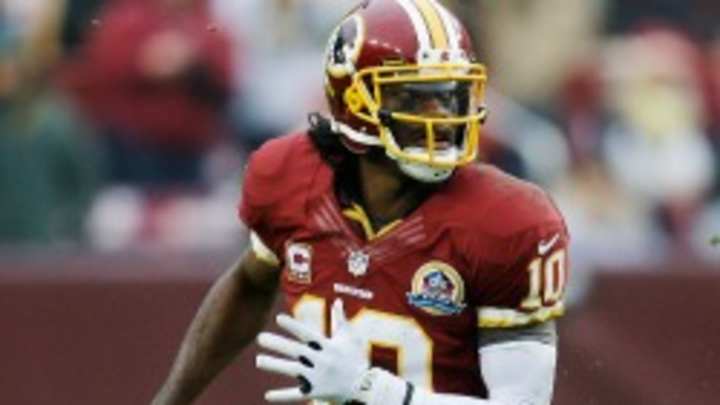 Robert Griffin III practices with Redskins despite sprained knee Robert Griffin III practices with Redskins despite sprained knee