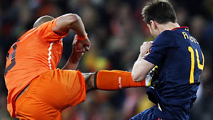 Spain overcomes Dutch brutality