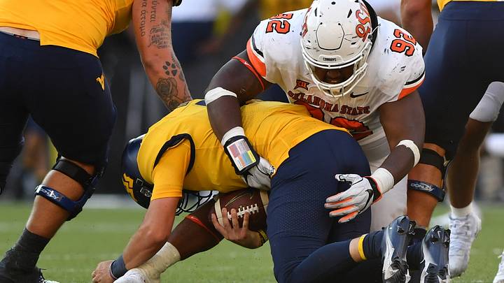 Cowboys Hang On for 27-13 Win Over West Virginia in Big 12 Opener Cowboys Hang On for 27-13 Win Over West Virginia in Big 12 Opener