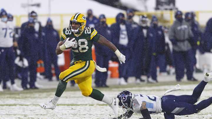 AJ Dillon Scores First Two NFL Touchdowns in Big Win Over Titans AJ Dillon Scores First Two NFL Touchdowns in Big Win Over Titans