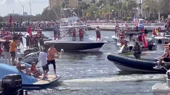 Tom Brady Throws Lombardi Trophy From One Boat to Another at Bucs' Super Bowl Parade