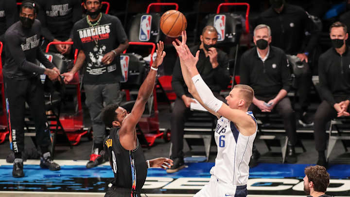 Doncic, Porzingis Dominate; Mavs Down Shorthanded Nets 115-98