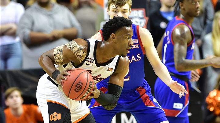 Cowboys' Second Half Collapse Results in 65-50 Loss to Kansas Cowboys' Second Half Collapse Results in 65-50 Loss to Kansas