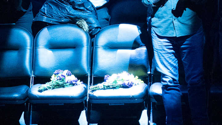 Nets honor the life of Kobe Bryant and daughter Gigi with Purple and Gold bouquet of flowers on courtside seats they sat at just a month ago