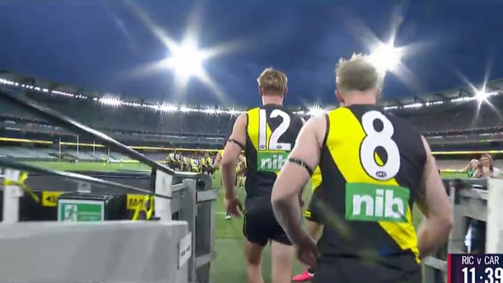 Watch the Eerie Scene as Aussie Rules Football Teams Enter Empty Stadium