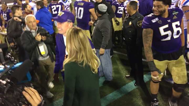 A Classic Scene-Stealer: Watch Ex-Husky Nick Harris Photobomb His Coach