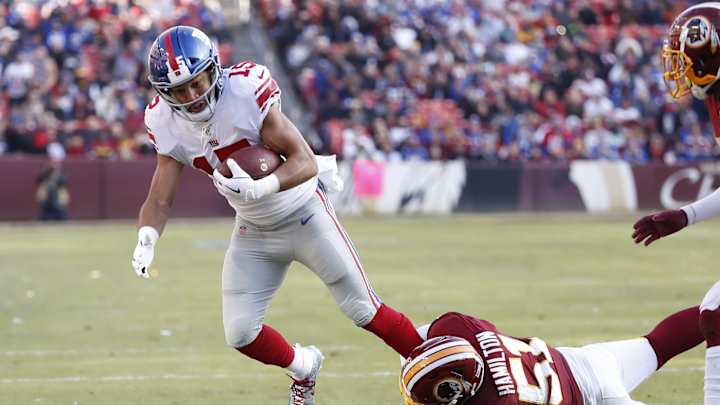 Washington Cuts Draft Pick, Signs 13 'Futures'