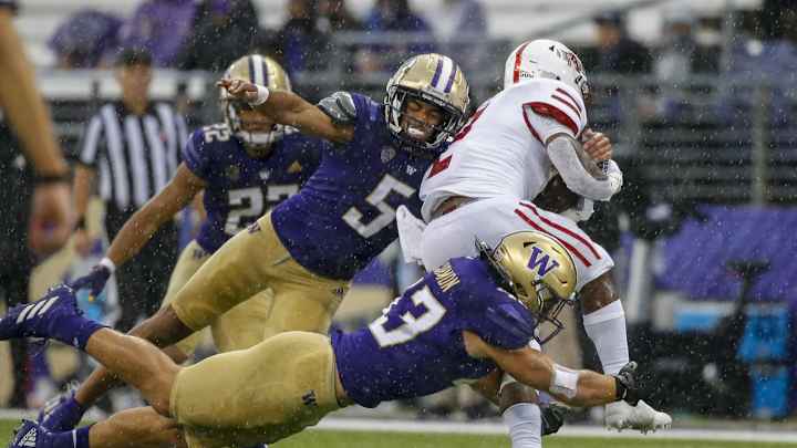 Gently Sidestepping Grandpa's Blitz, Cook Chose Huskies