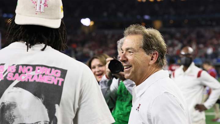 Nick Saban Strikes Album Cover Pose With Cotton Bowl Trophy