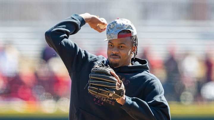 Smith's Pitching, Moore's Hits Pace Hogs to First Win of Season