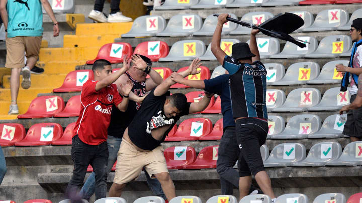 Liga MX Match Ends After Horrific Violence in Stands Between Rival Fan Bases Spills Onto Field