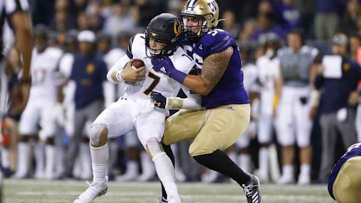 Laiatu Latu's Husky Career Ended by Neck Injury Laiatu Latu's Husky Career Ended by Neck Injury