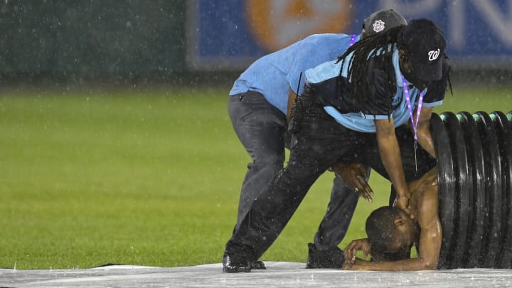Fully Nude Nationals Park Streaker Tries to Hide in Tarp Roller During Rain Delay Fully Nude Nationals Park Streaker Tries to Hide in Tarp Roller During Rain Delay