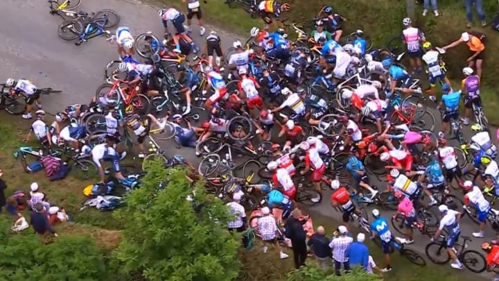 Spectator's Sign Causes Massive Crash on Tour de France's First Day Spectator's Sign Causes Massive Crash on Tour de France's First Day