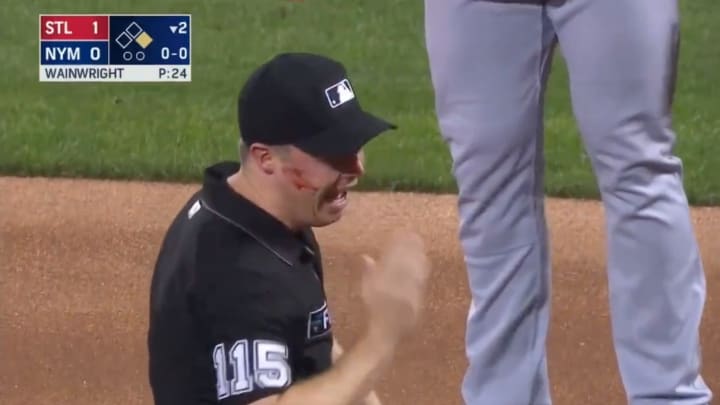 Umpire Junior Valentine Struck in Face by Errant Throw, Remains in Game Umpire Junior Valentine Struck in Face by Errant Throw, Remains in Game