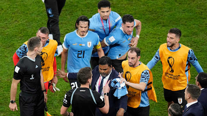 Uruguay Players Follow Officials Into Tunnel After World Cup Elimination