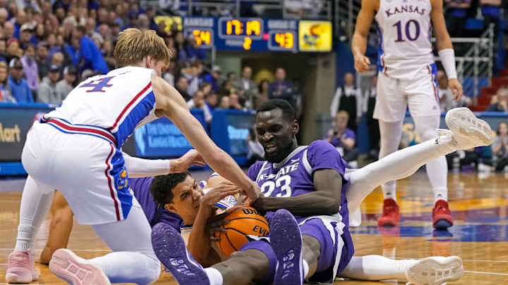 Kansas trio lead balanced effort to 90-78 win over Kansas State in foul-filled game.