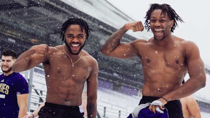 Huskies Don't Let a Little Snow Bother Them During Winter Workouts